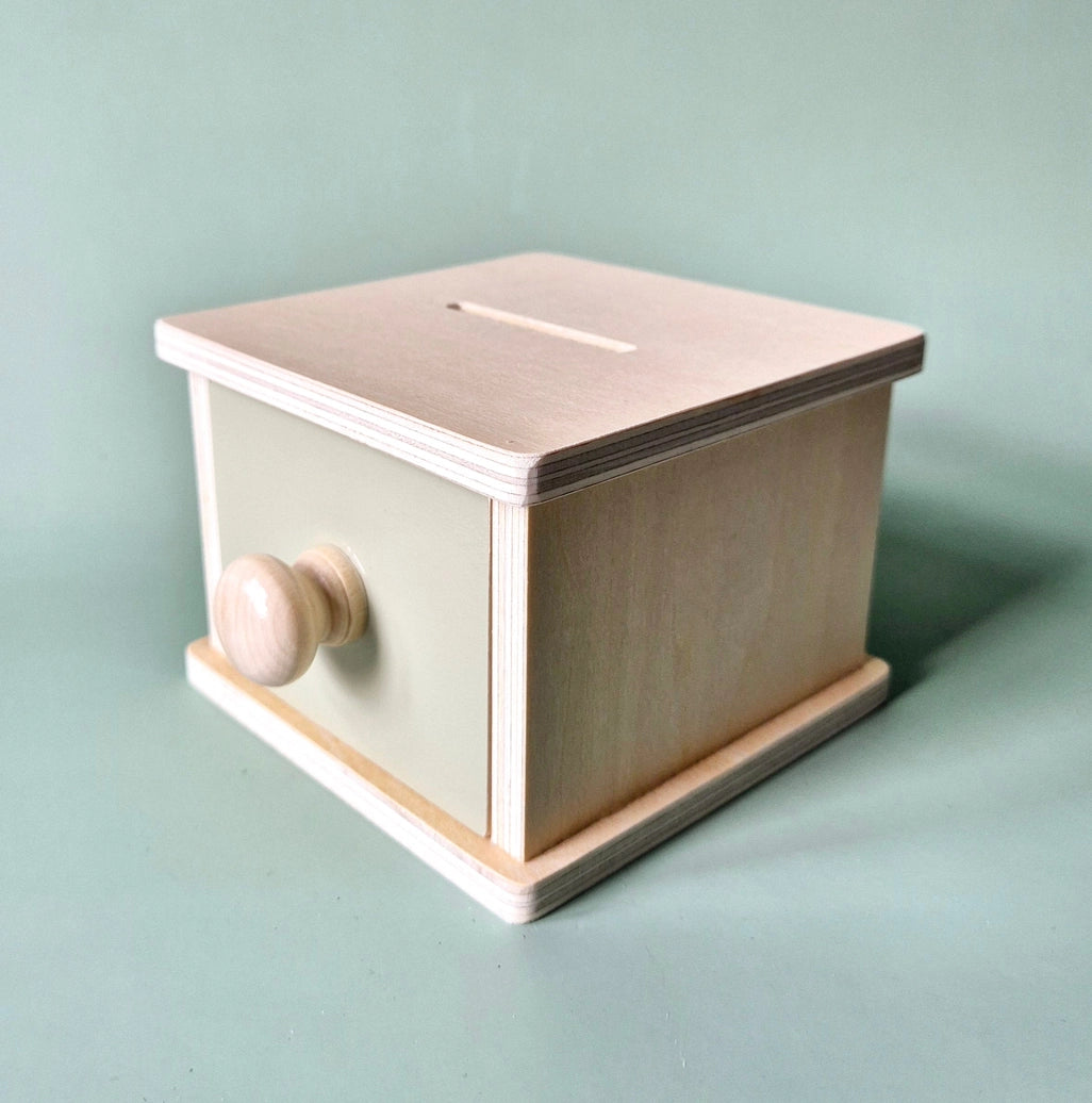 Wooden learning box with drawer and colored discs for object permanence and sensory exploration