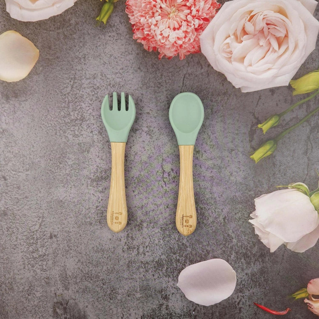 Baby spoon and fork made from bamboo and food grade silicone in cameo green
