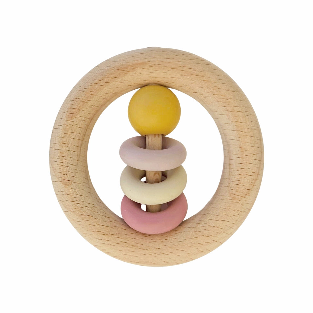 Baby wooden ring rattle in ochre color for sensory development and early grasping skills