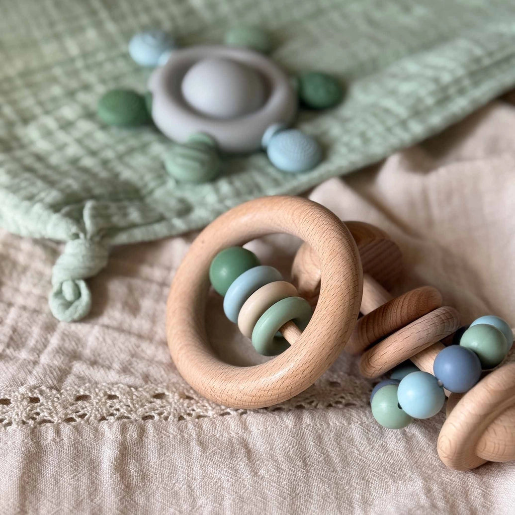 Natural wooden baby ring rattle green toy for newborn sensory play and motor development