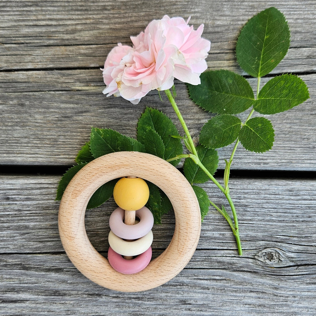 Ochre wooden baby rattle with smooth ring design for infants and Montessori inspired play