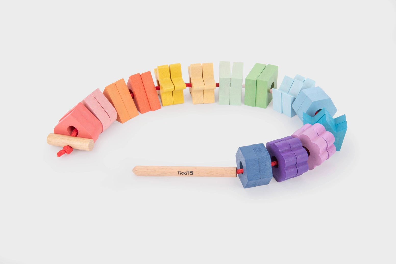 Rainbow wooden lacing shapes for toddlers developing fine motor skills and hand eye coordination
