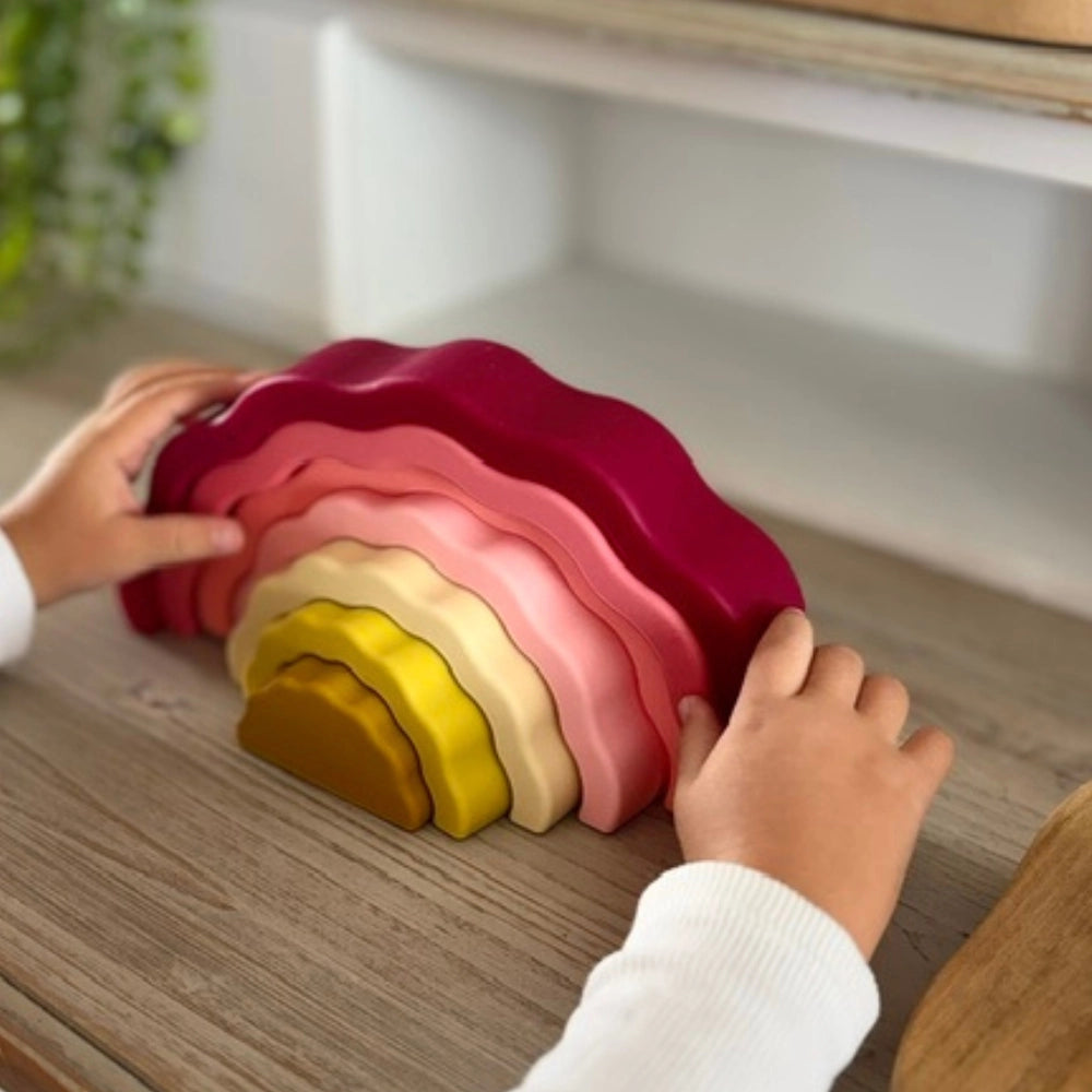 Silicone stackable rainbow toy for toddlers encouraging creativity open ended play and imagination